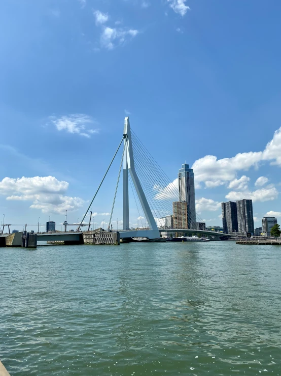 a large long bridge on the side of the water