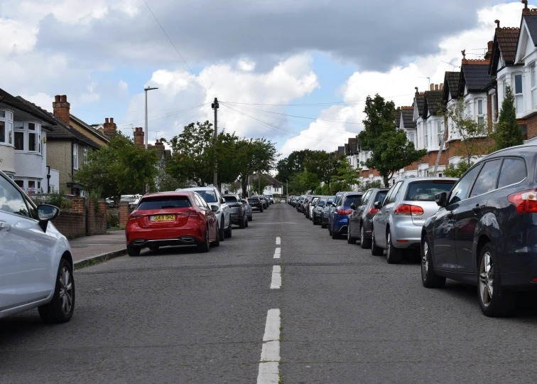 a row of cars parked on a street