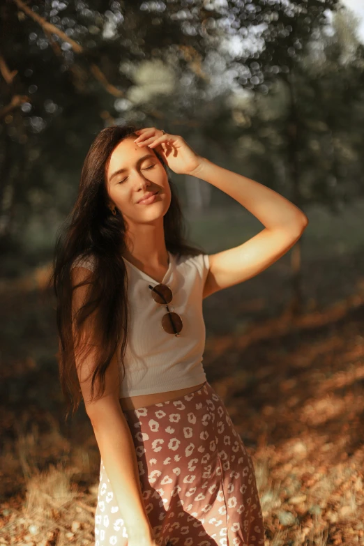 a woman holding her head to her forehead