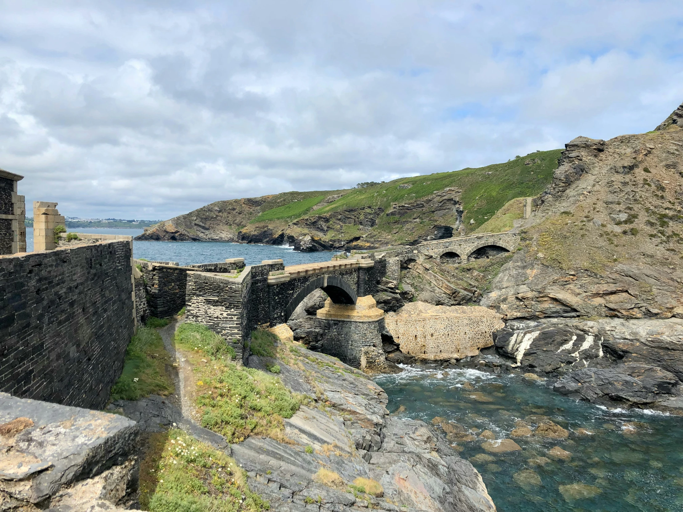 some rocky shoreline with some water near it