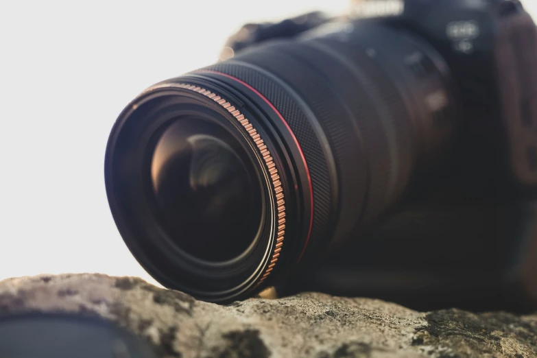 a close up of a camera on top of some rocks