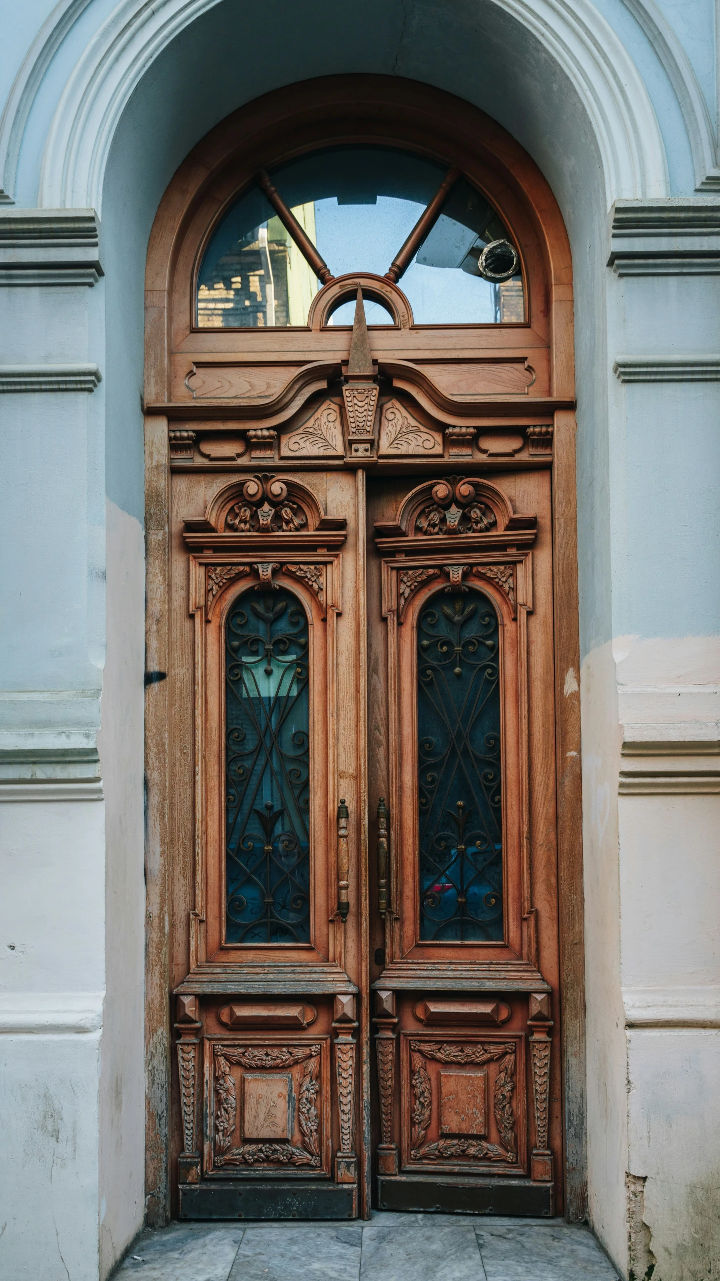 a big wooden door that is on a building