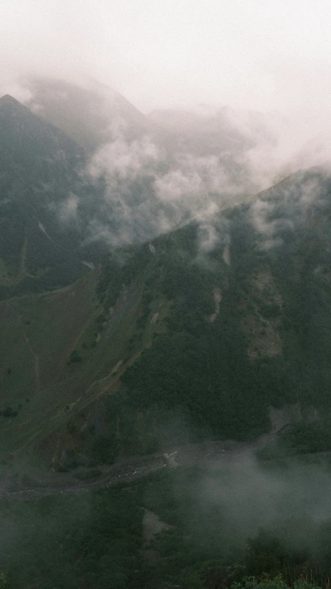 a po of clouds on the side of a hill