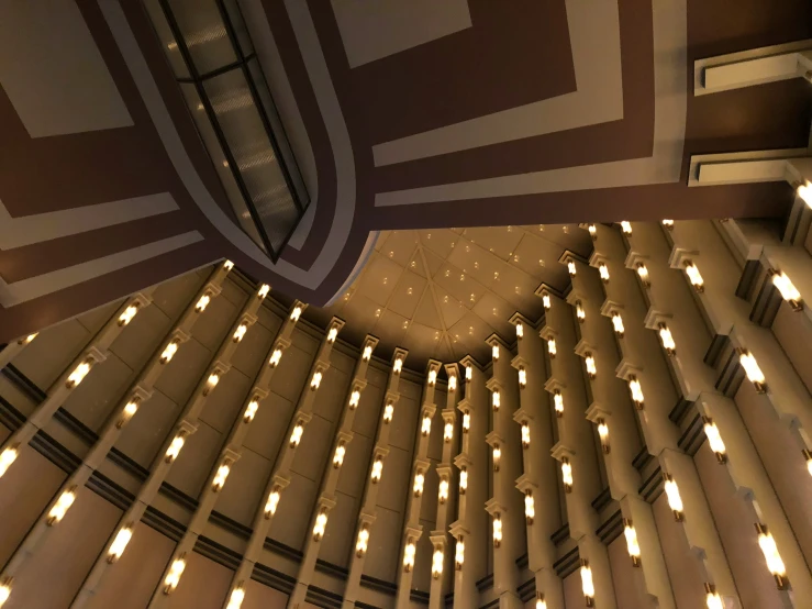 the ceiling inside a building made from large white lights