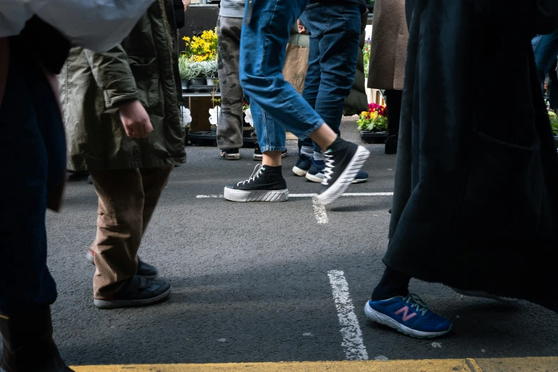 people walking around with shoes that look like they are wearing shoes