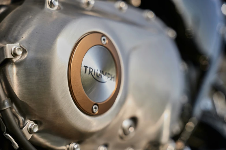 the fuel cap on an old motorcycle is clearly visible