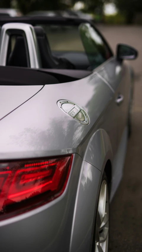 a closeup po of some shiny silver cars