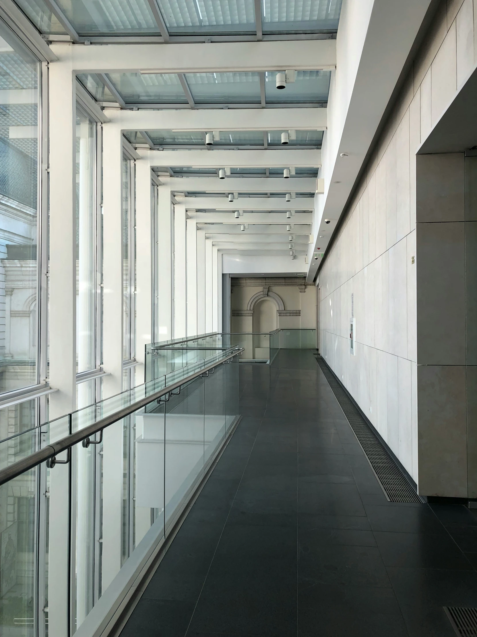 a large building with a long hallway that leads into another area