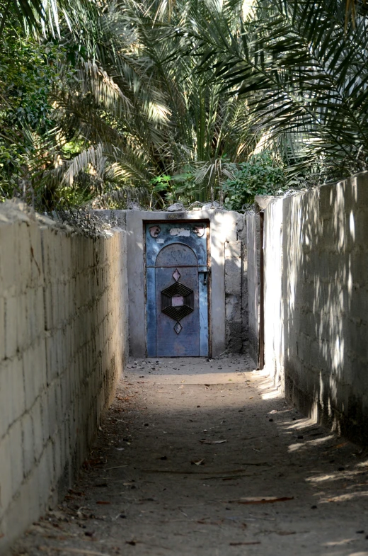 a door and wall is shown between two streets