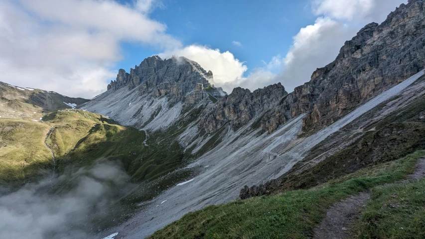 a view of mountains from the ground