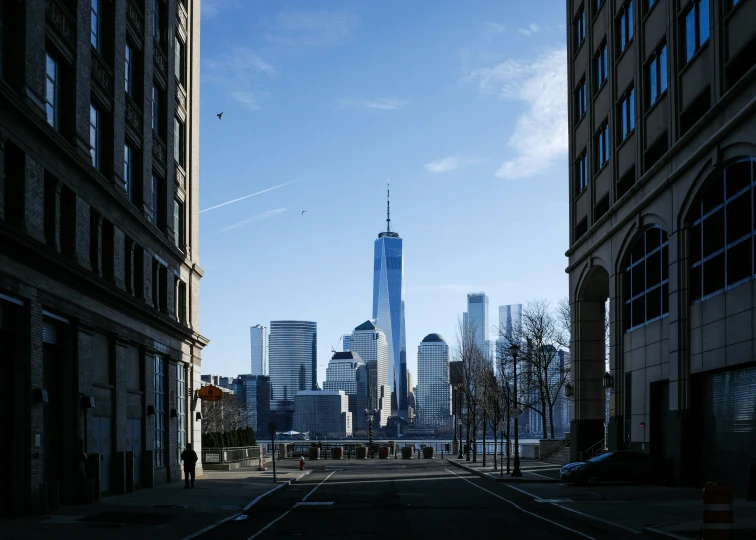 an empty street surrounded by tall buildings with no traffic