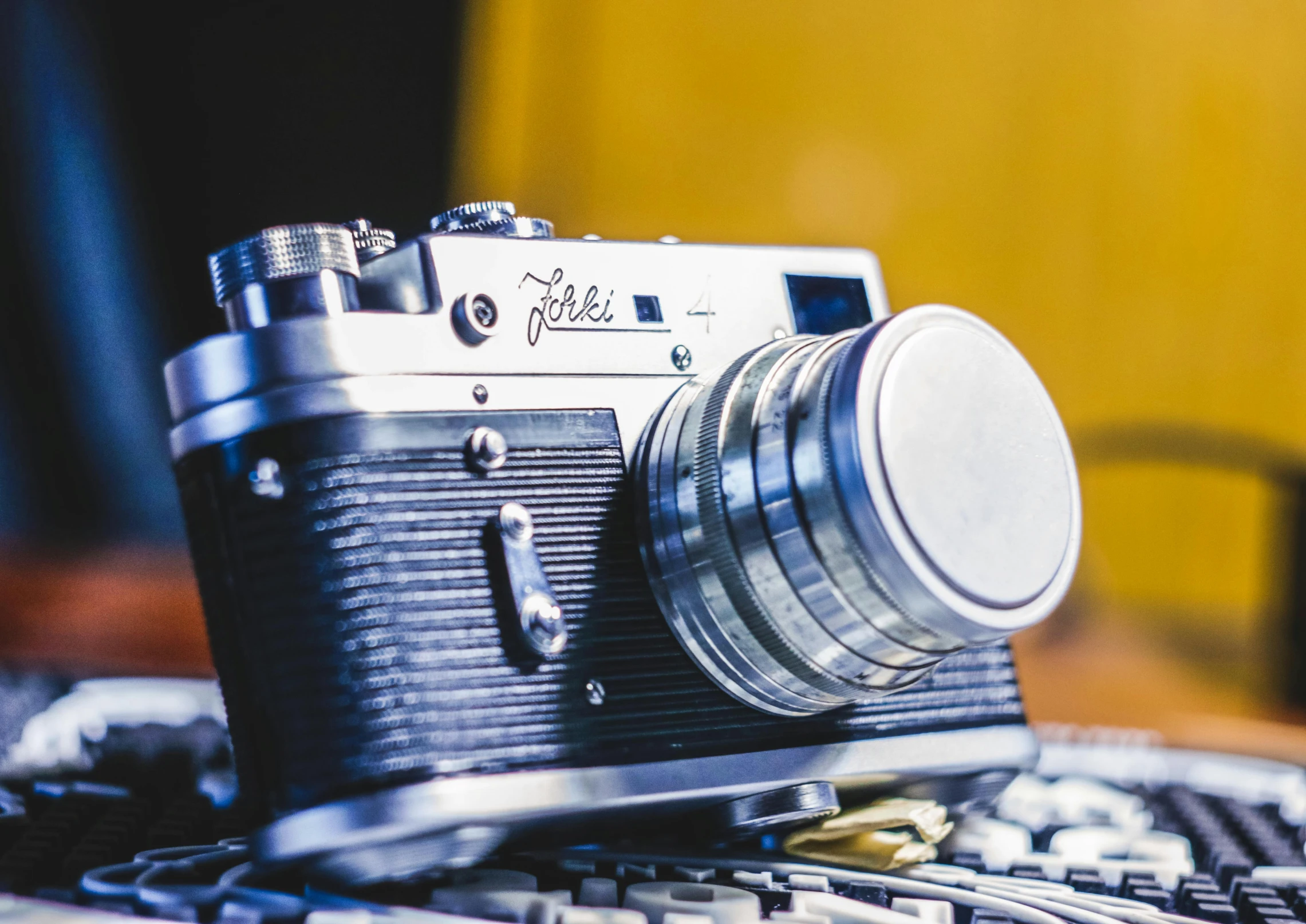 a closeup view of an old camera with its lens pointed down