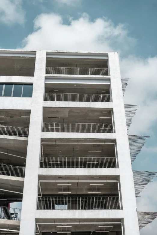 an architectural building, with many balconies that appear to have been made of iron