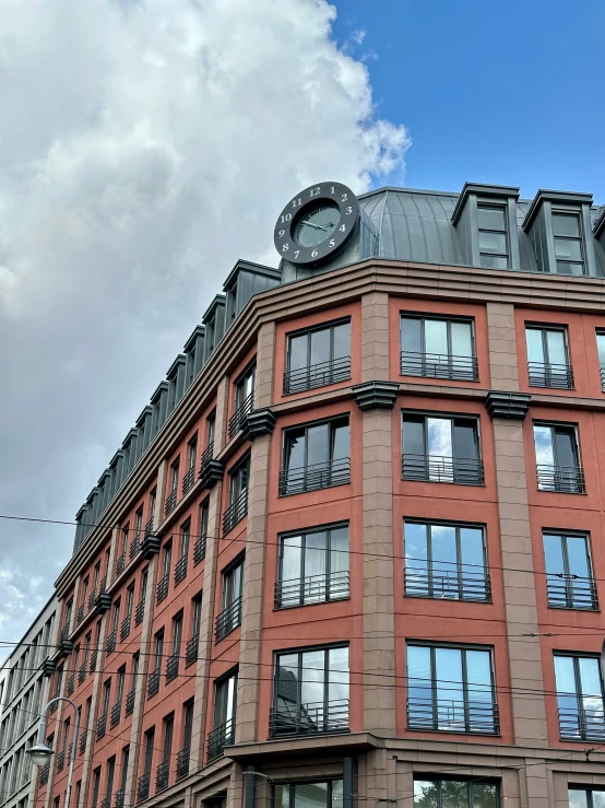 a building with an ornate round window that has a clock on it