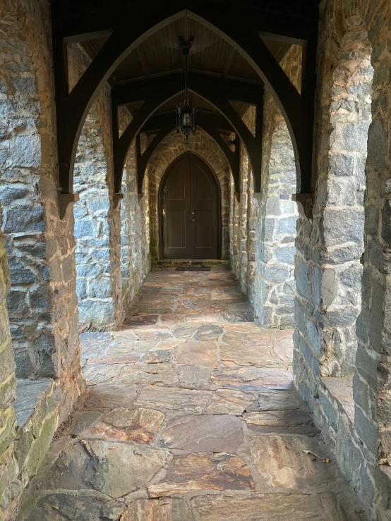 the tunnel is lined with stone and has a clock