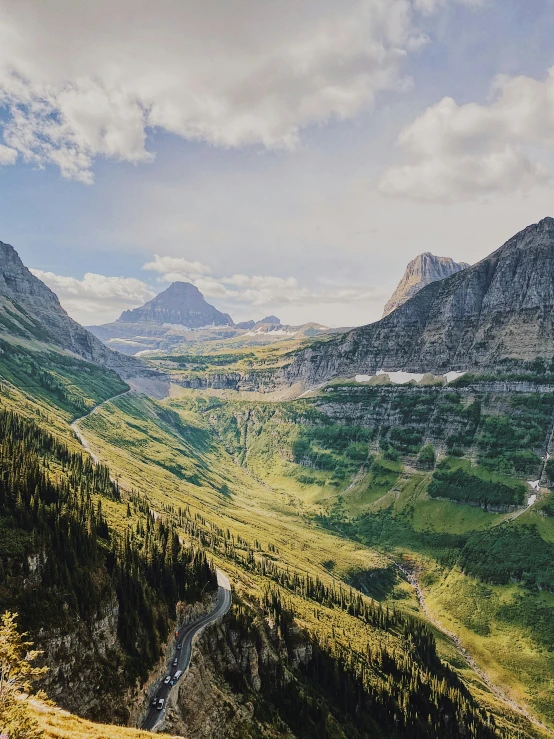 a couple of mountains with lots of trees