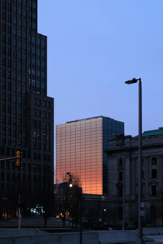 a street light near some tall buildings