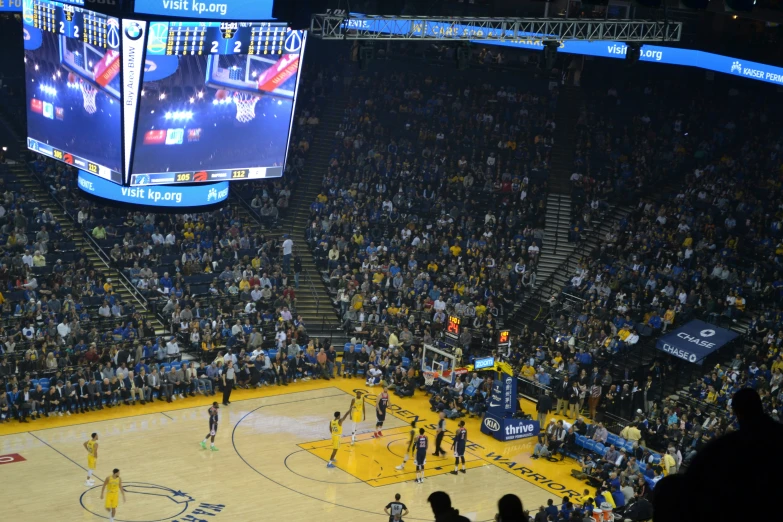 several basketball players are playing a game in an arena