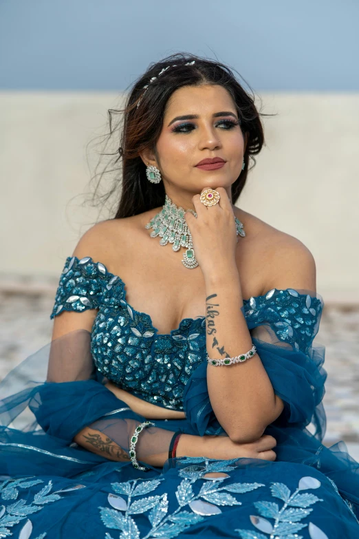 a woman in a blue dress posing for a picture