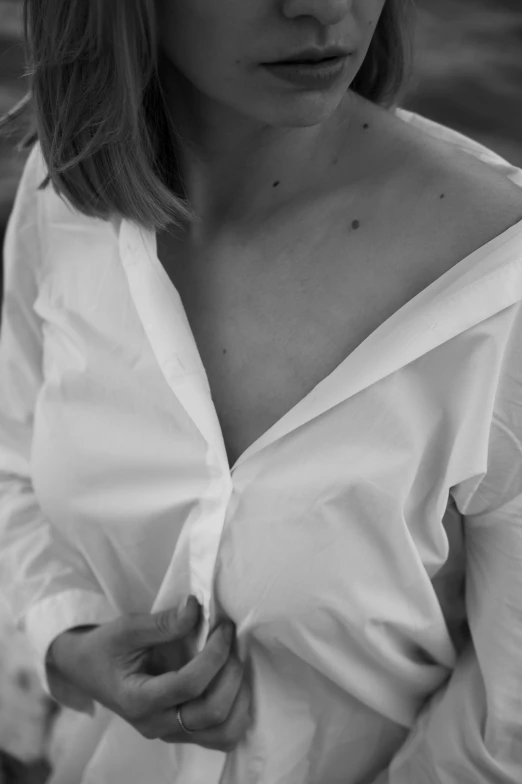 a close up of a person wearing a white shirt