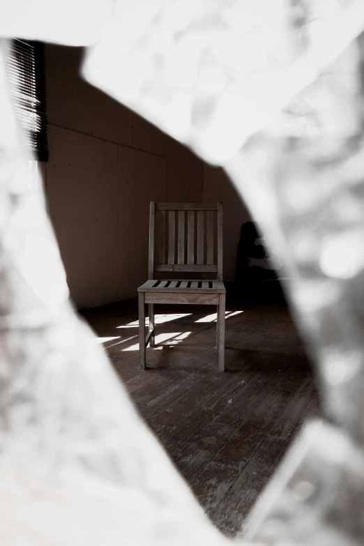 a chair sits on the ground near a wall