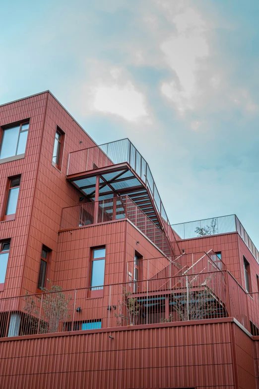 a red building with steps on each level