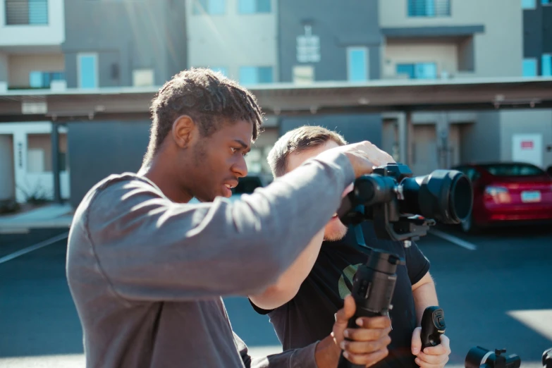 the man and woman are filming the camera