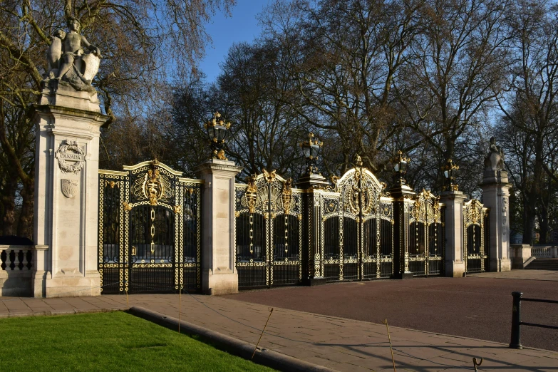 the fence is decorated with golden christmas lights