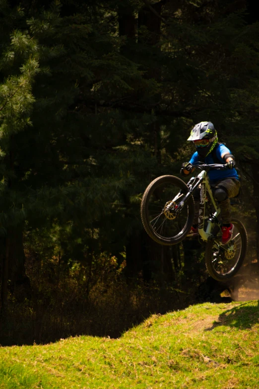 a man flying through the air while riding a motorcycle