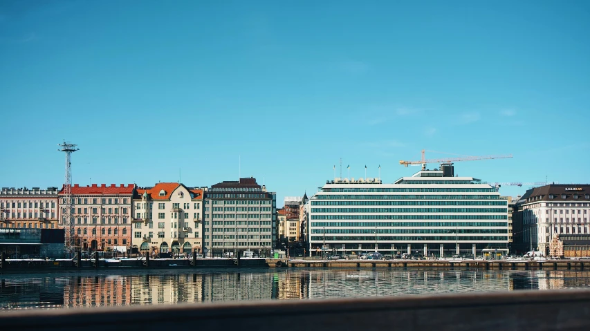 view of some buildings in a city across the water