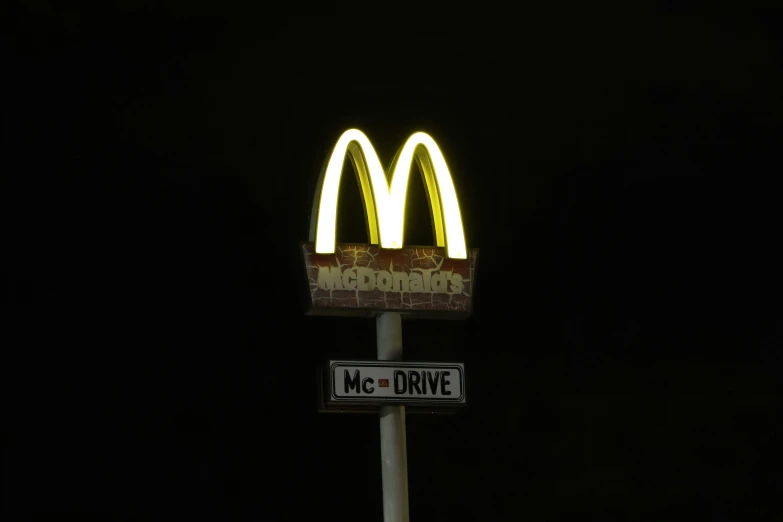 the lighted sign is against the black background