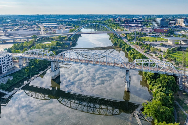 a bridge over a river going through a town