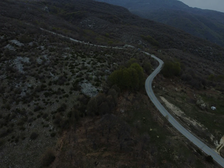 two roads through the mountains on a cloudy day