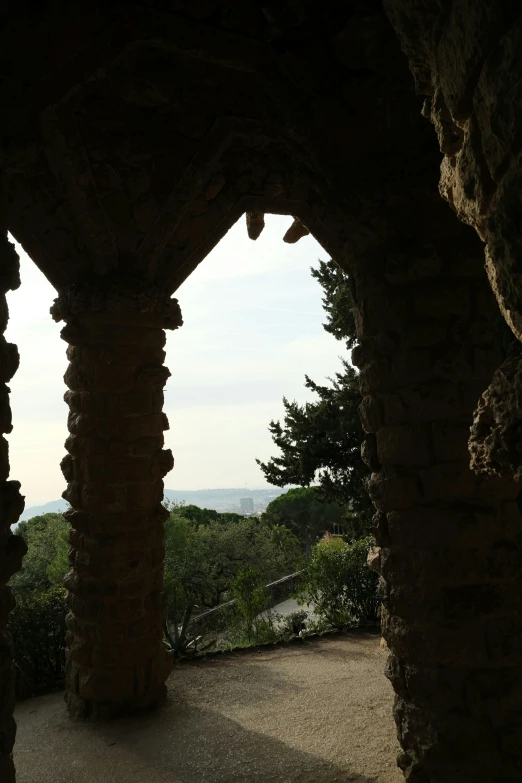 an arched walkway overlooks the scenic landscape