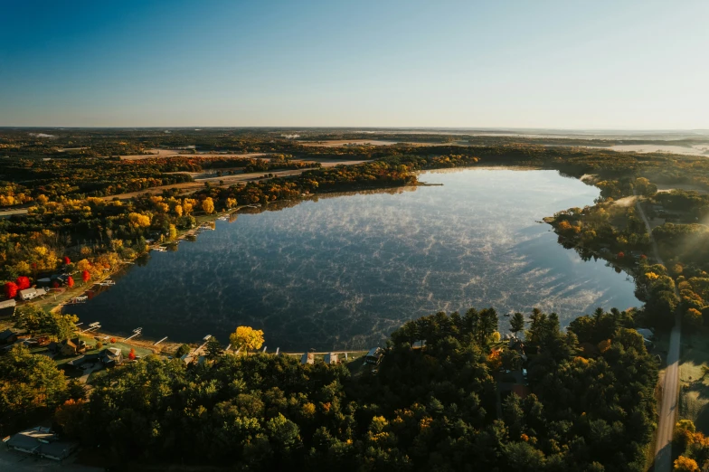 the lake is in the middle of the forested area