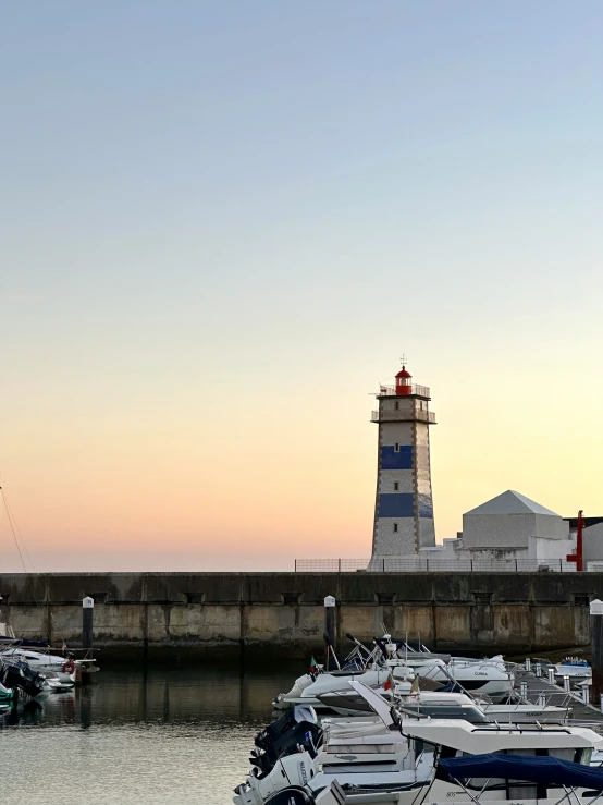 a light house is sitting on top of a small tower