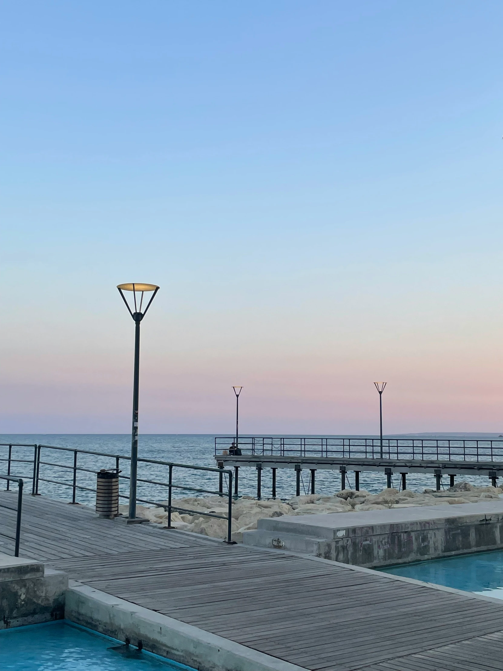 a pier with a light post next to it