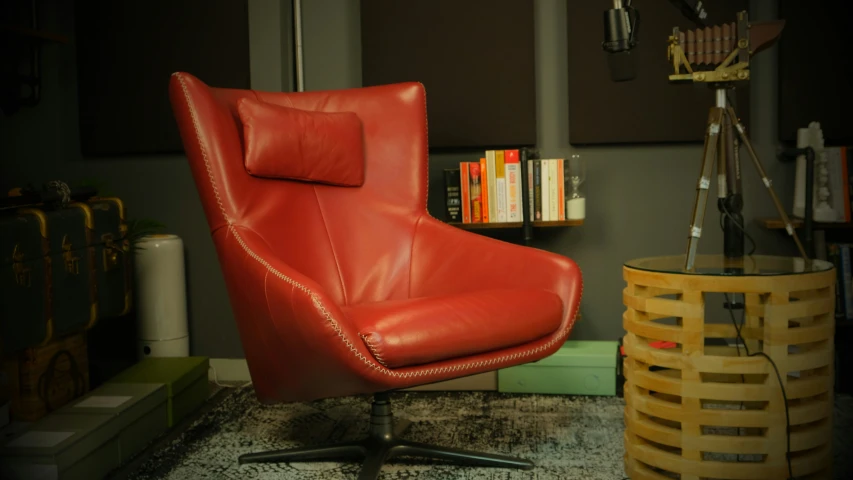 a red chair sitting on top of a rug