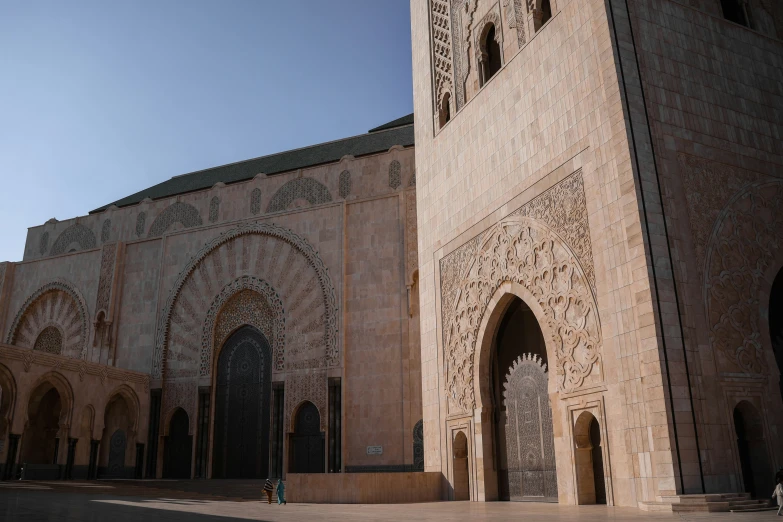 a very tall building with arched windows in front of it