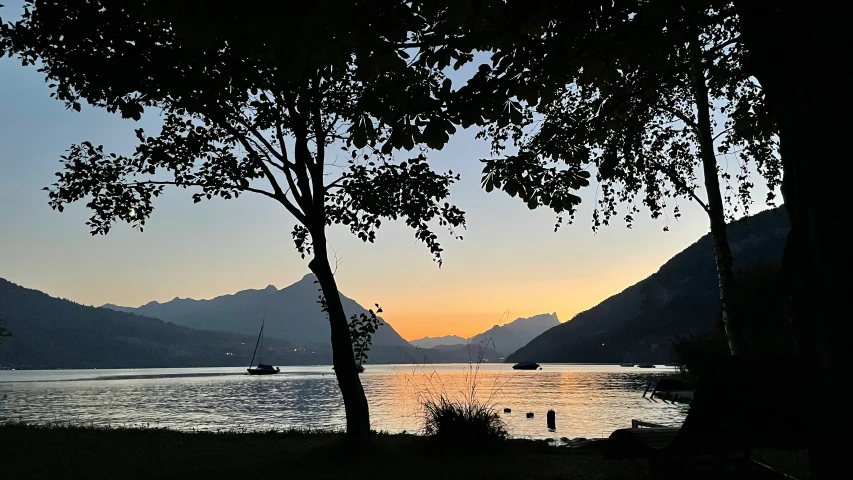 a view of the lake at sunrise from a lakeside