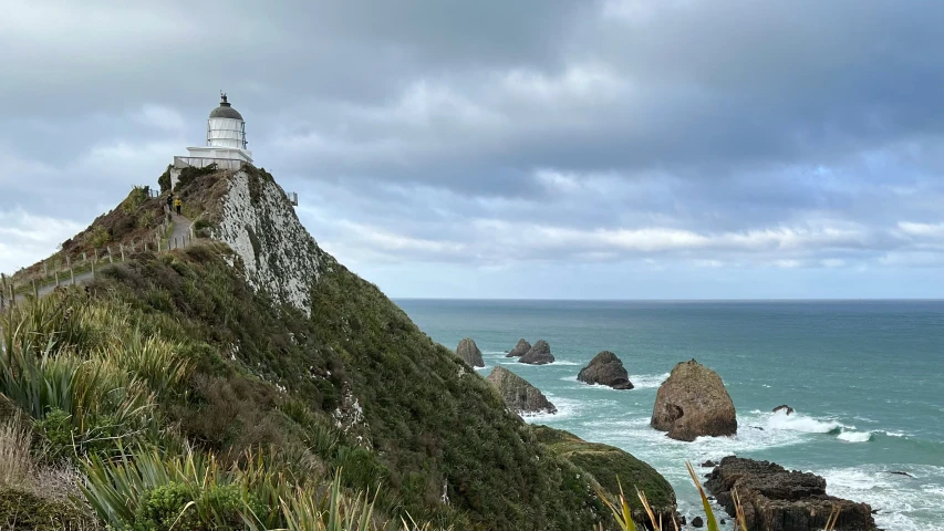 an image of a lighthouse on the coast