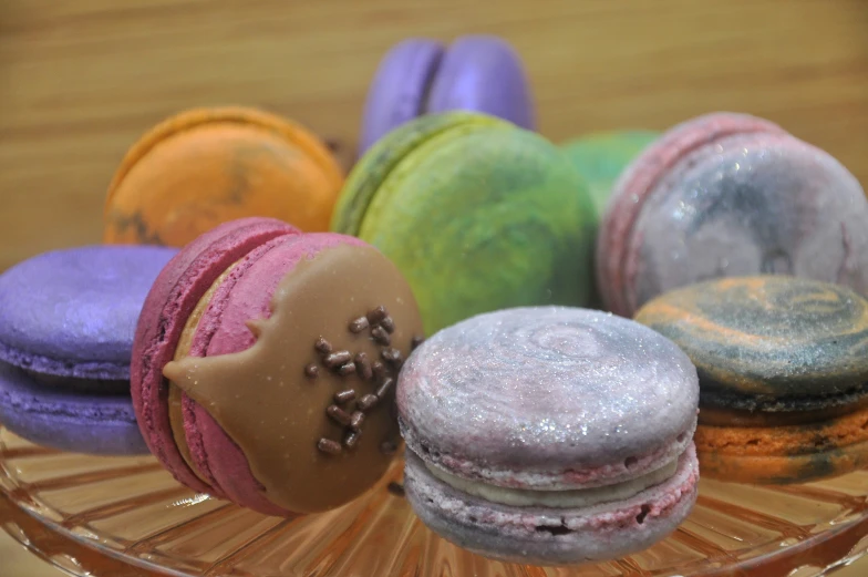 this is a group of various colored macarons