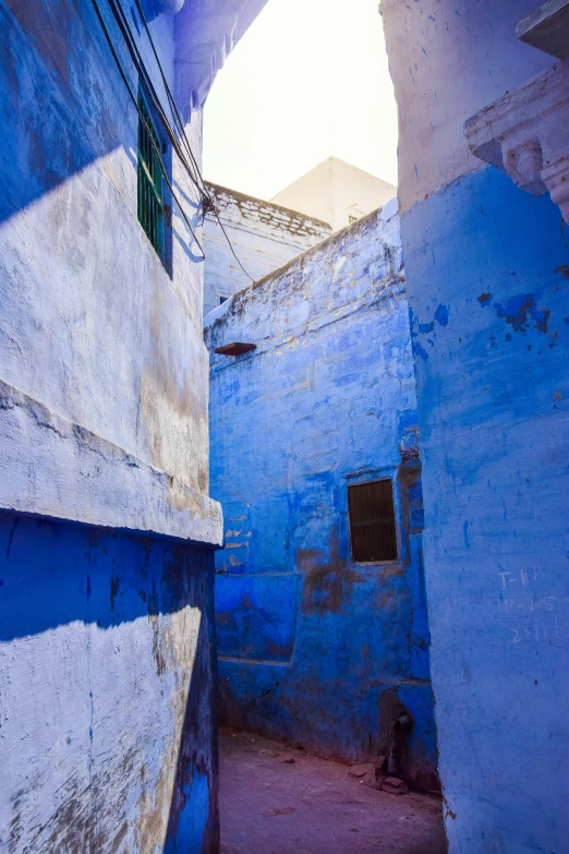 a narrow alley in the middle of an old building