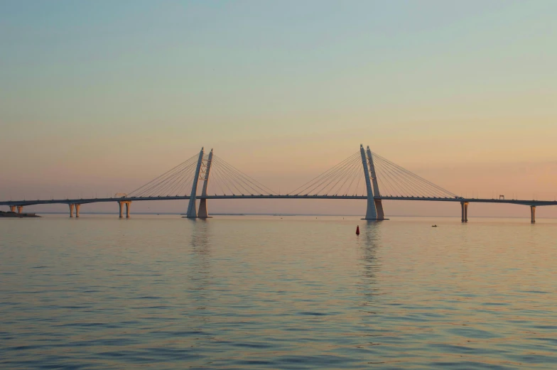 there are three tall bridges spanning the width of the water