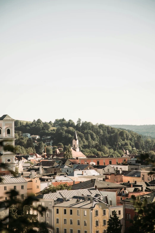 a city view from the top of a hill with buildings on it