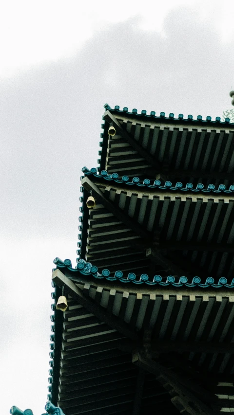 a picture taken from below of a pagoda type structure