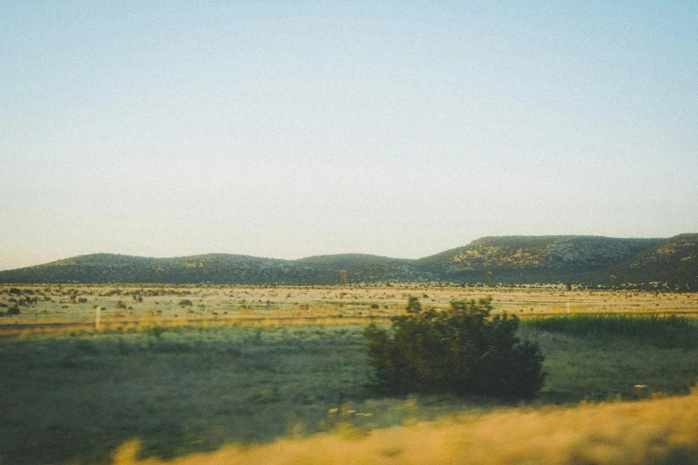 there is a view of mountains through the windshield of a car