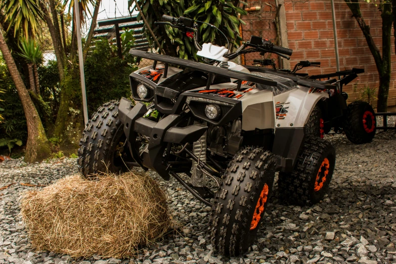 a two wheeled vehicle is sitting by some grass