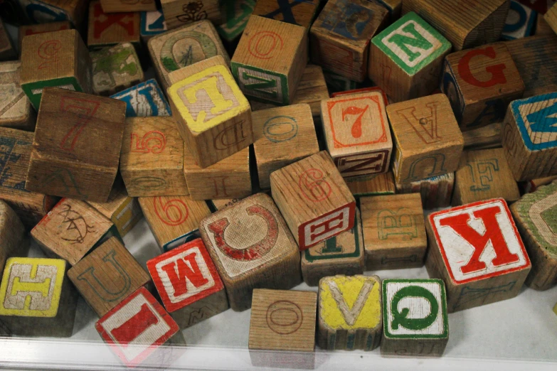 some type of wood stamps that have letters spelled with them