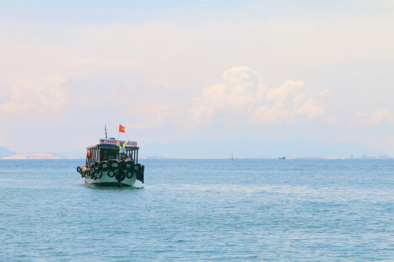 a small boat that is out on the water